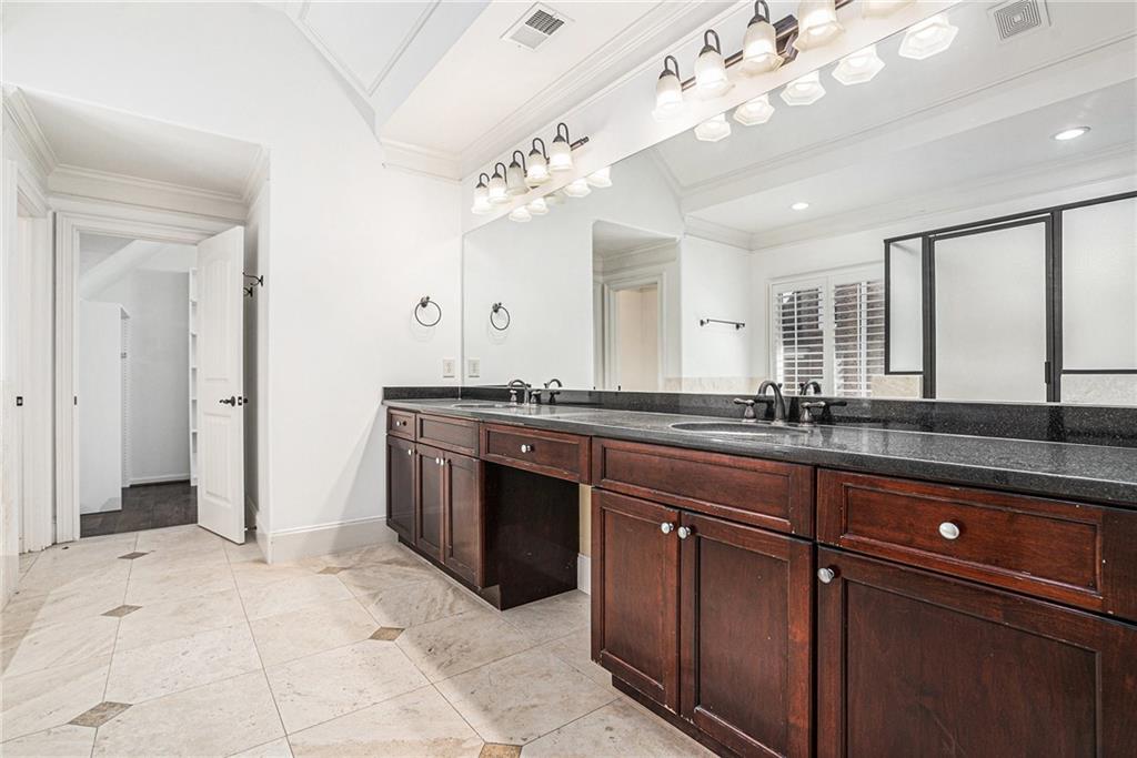 3301 Chastain Ridge Drive Marietta, GA 30066 - Photo 24 of 50 a spacious bathroom with a granite countertop double vanity sink a mirror and a shower