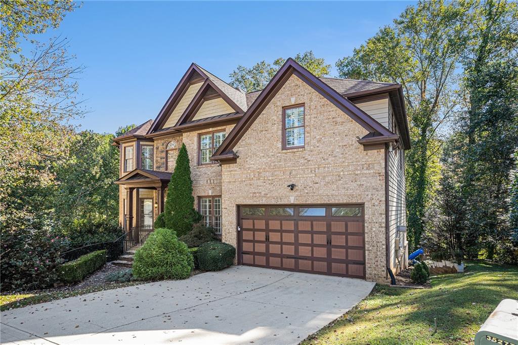 3301 Chastain Ridge Drive Marietta, GA 30066 - Photo 3 of 50 a front view of a house with a yard