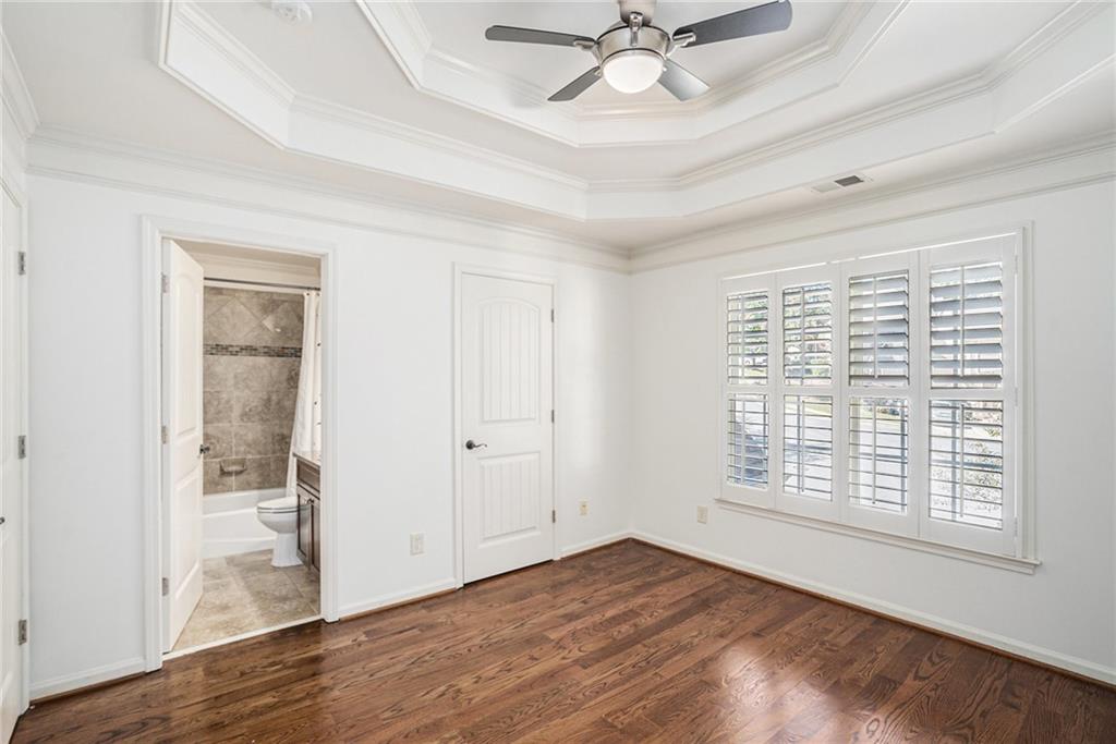 3301 Chastain Ridge Drive Marietta, GA 30066 - Photo 31 of 50 a view of an empty room with wooden floor and a window