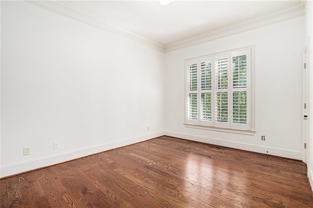 3301 Chastain Ridge Drive Marietta, GA 30066 - Photo 33 of 50 an empty room with wooden floor and windows