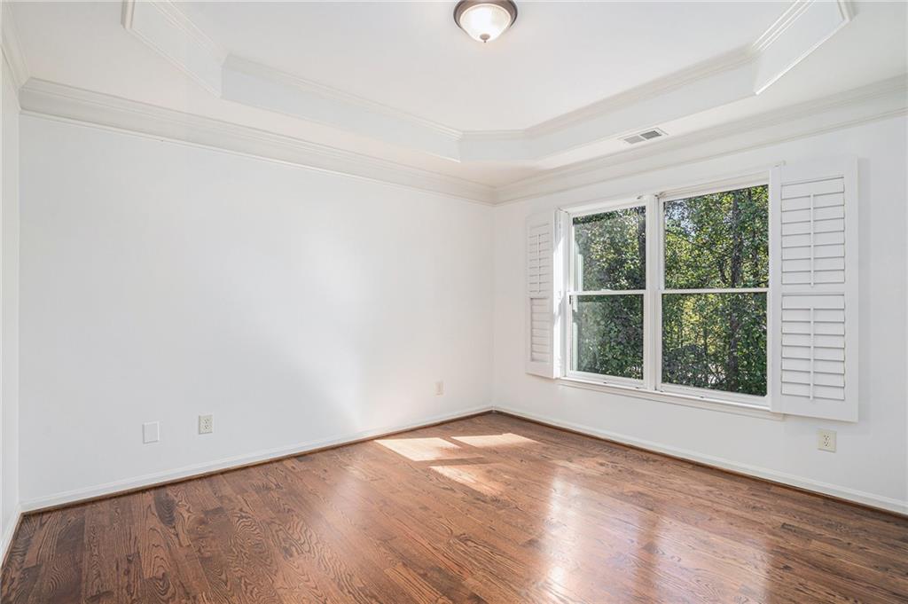 3301 Chastain Ridge Drive Marietta, GA 30066 - Photo 34 of 50 an empty room with wooden floor and windows