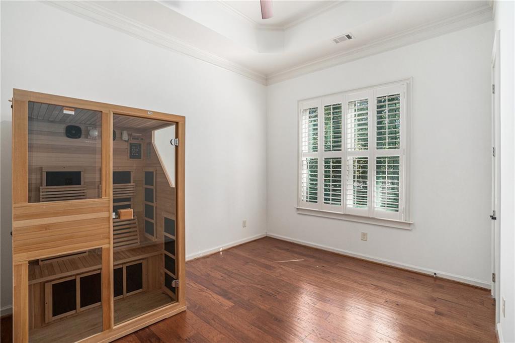 3301 Chastain Ridge Drive Marietta, GA 30066 - Photo 35 of 50 a view of an empty room with wooden floor and a window
