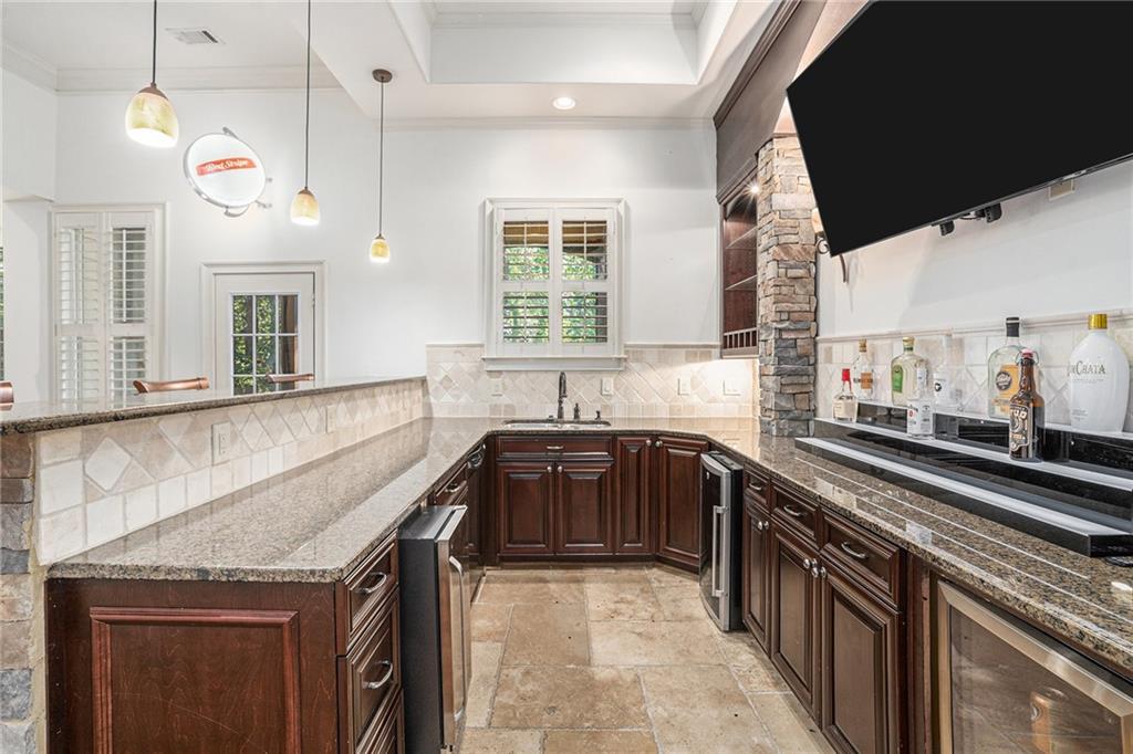 3301 Chastain Ridge Drive Marietta, GA 30066 - Photo 40 of 50 a kitchen that has a sink and a stove