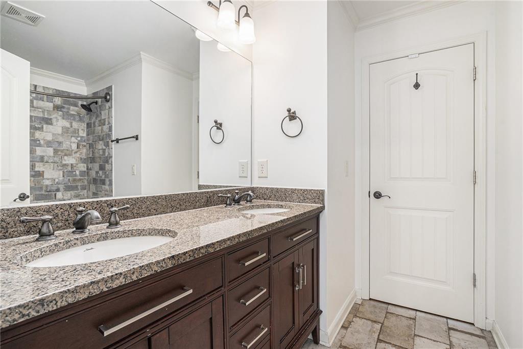 3301 Chastain Ridge Drive Marietta, GA 30066 - Photo 42 of 50 a bathroom with a granite countertop sink and a mirror