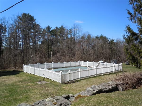 29 Putnam Road Sturbridge, MA 01566 - Photo 14 of 19 a view of a house with a yard and sitting area