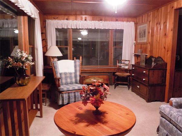 29 Putnam Road Sturbridge, MA 01566 - Photo 4 of 19 a dining room with furniture a chandelier and wooden floor