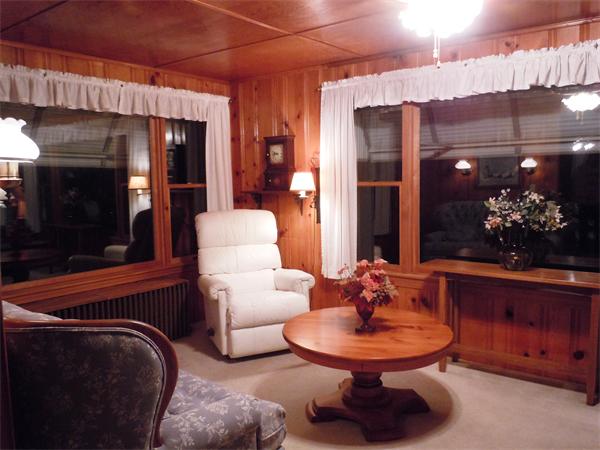 29 Putnam Road Sturbridge, MA 01566 - Photo 6 of 19 a living room with furniture a flowers and a fireplace