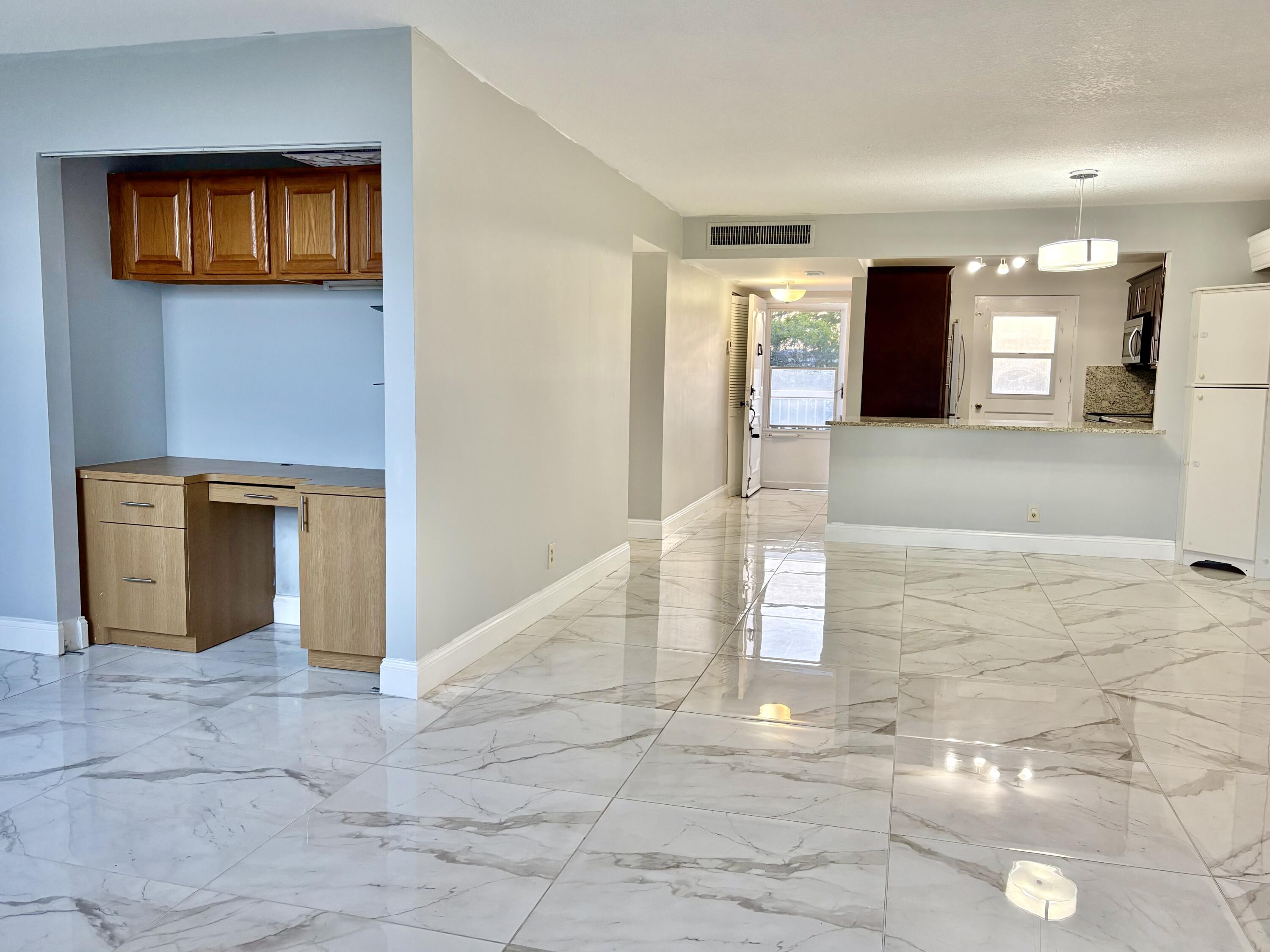 5700 Northwest 2nd Avenue, Unit 311 Boca Raton, FL 33487 - Photo 10 of 33 LIVING ROOM AND DEN