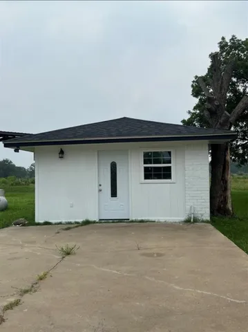 a house with trees in front of it
