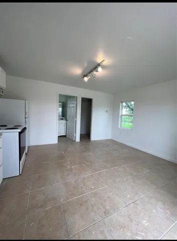 a view of an empty room with a window