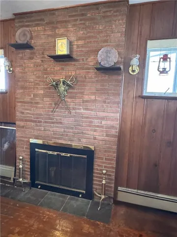 a brick oven with fireplace and wooden floor