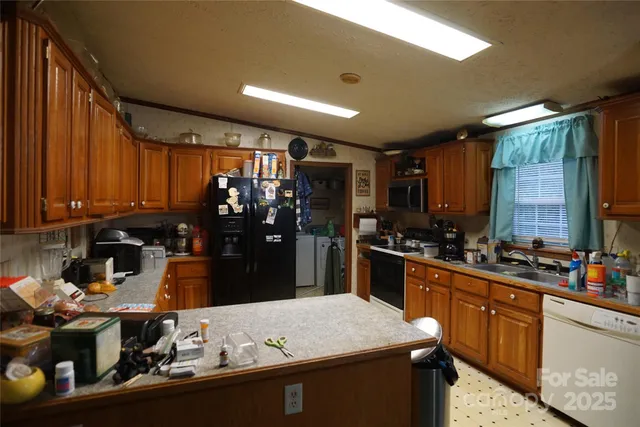 a kitchen with a sink and stove