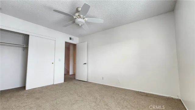 a view of a hallway with staircase