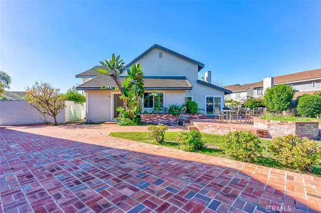 a front view of house with yard and outdoor seating