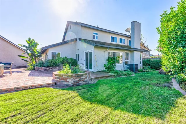 a view of a backyard with sitting area