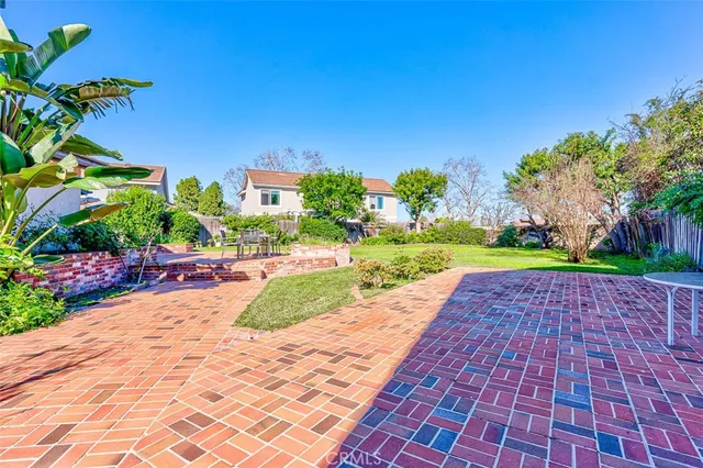 a view of a park with large trees