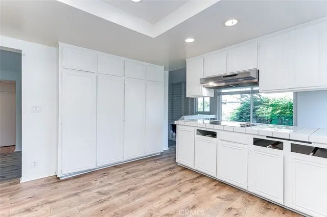 a kitchen with a sink and cabinets
