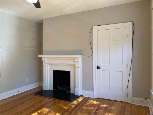 116 Forest Road Raleigh, NC 27605 - Photo 3 of 11 a view of a livingroom with a fireplace