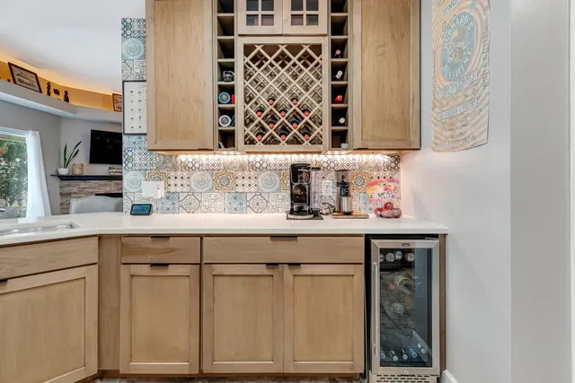 a white refrigerator freezer and a stove sitting inside of a kitchen