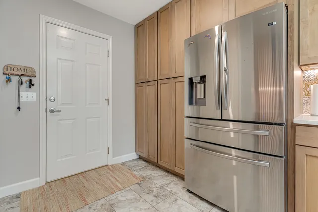 a kitchen with a sink and a refrigerator