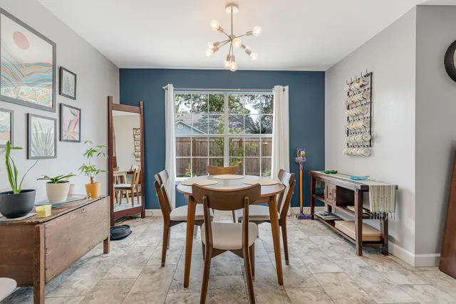 a living room with stainless steel appliances kitchen island granite countertop furniture and a kitchen view