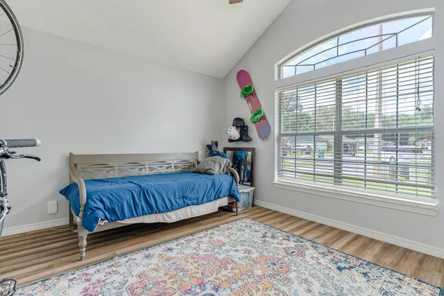 a bathroom with a shower curtain and a bath tub