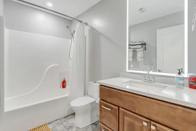 a view of a house with sitting area and garden