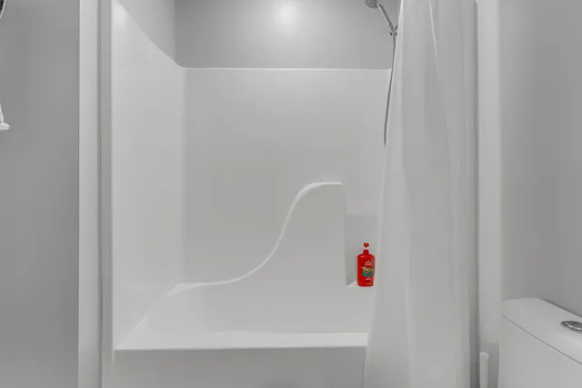 a white house with trees in front of it