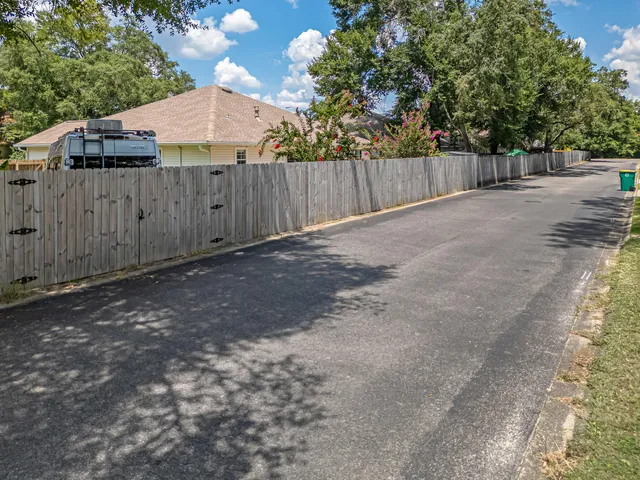 an aerial view of a house with a yard and outdoor space