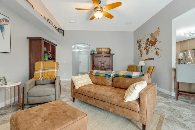 a bedroom with furniture and a wooden floor