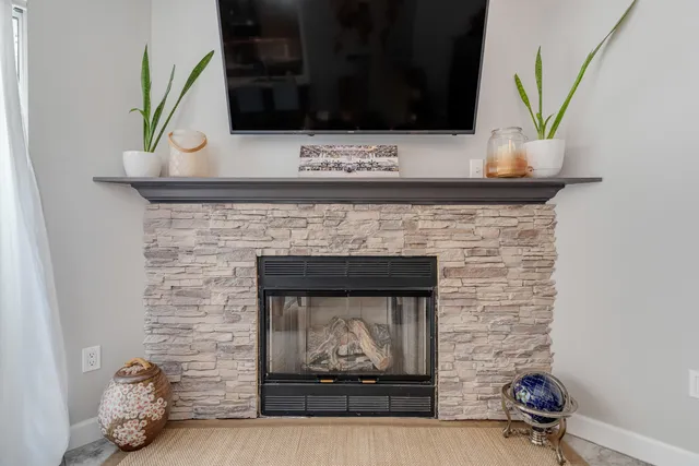 a spacious bathroom with a sink double vanity granite and a mirror