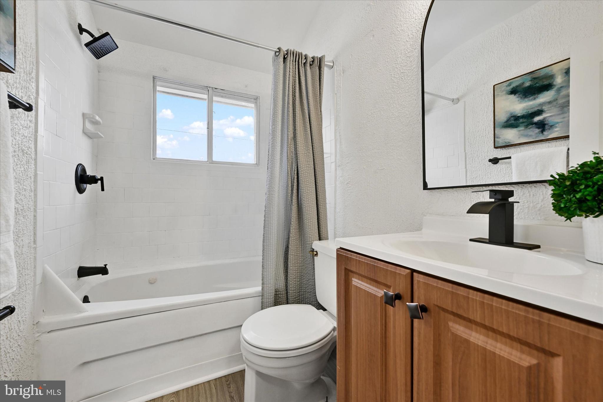 1945 Ormand Road Baltimore, MD 21222 - Photo 16 of 28 a bathroom with a sink toilet and shower
