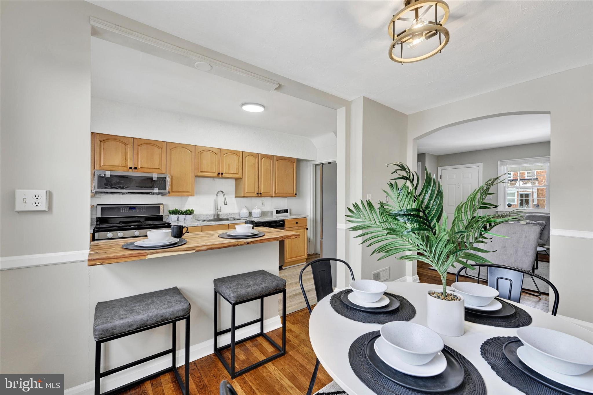 1945 Ormand Road Baltimore, MD 21222 - Photo 7 of 28 a kitchen with a table and chairs in it