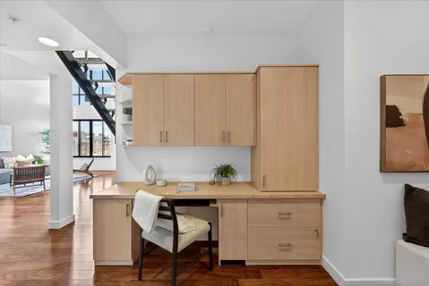 a view of cabinets and wooden floor