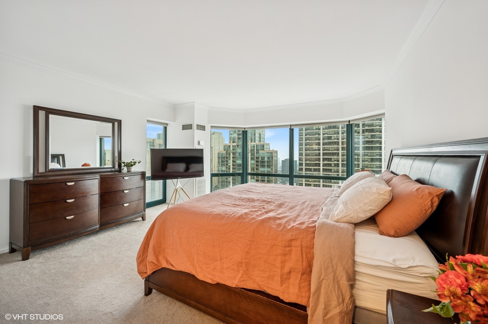 100 East Huron Street, Unit 3501 Chicago, IL 60611 - Photo 15 of 30 a bedroom with a bed and a fireplace