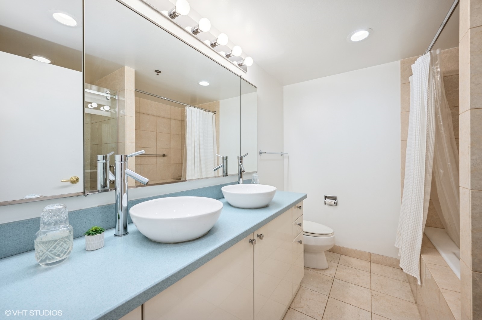 100 East Huron Street, Unit 3501 Chicago, IL 60611 - Photo 17 of 30 a bathroom with a granite countertop sink and a mirror
