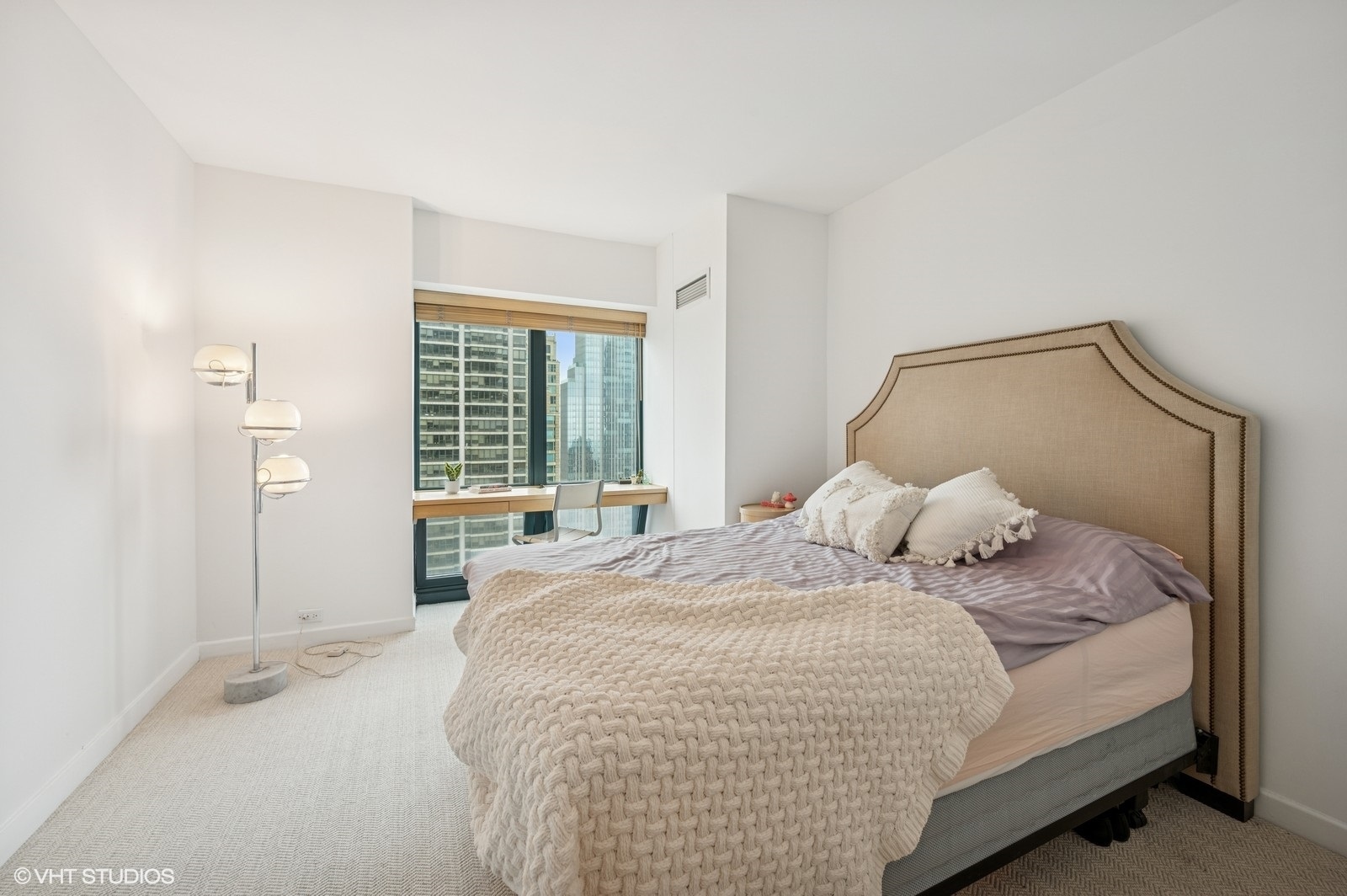 100 East Huron Street, Unit 3501 Chicago, IL 60611 - Photo 19 of 30 a bedroom with a bed and a large window