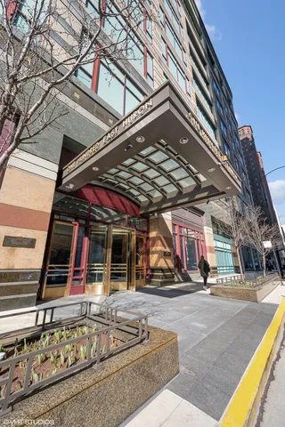 a view of a building with car parked