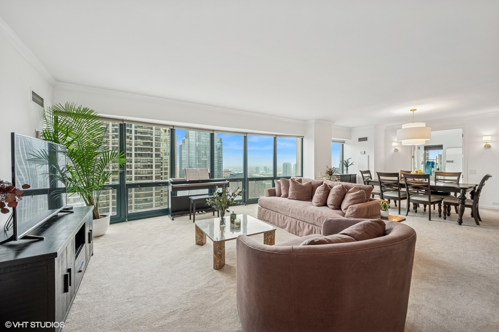 100 East Huron Street, Unit 3501 Chicago, IL 60611 - Photo 3 of 30 a living room with furniture and a large window