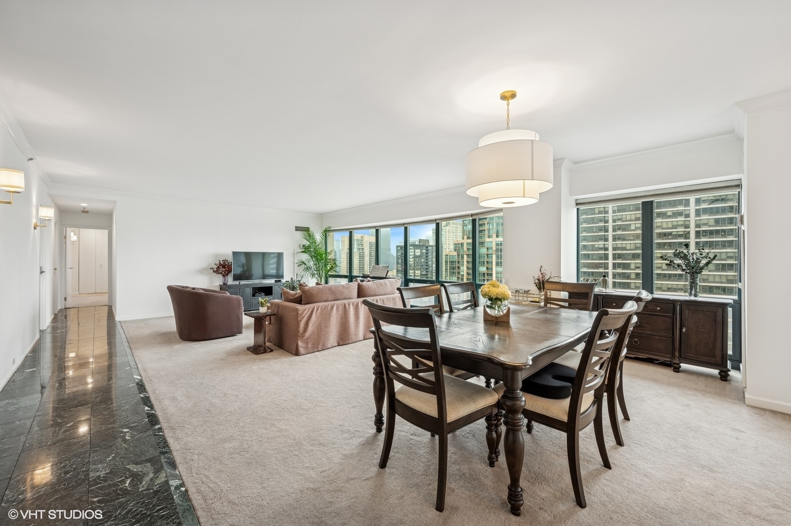 100 East Huron Street, Unit 3501 Chicago, IL 60611 - Photo 6 of 30 a dining room with furniture a chandelier and window