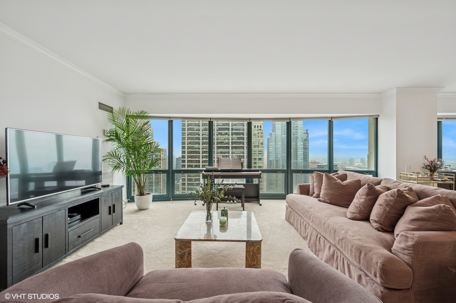 100 East Huron Street, Unit 3501 Chicago, IL 60611 - Photo 8 of 30 a living room with furniture and a flat screen tv