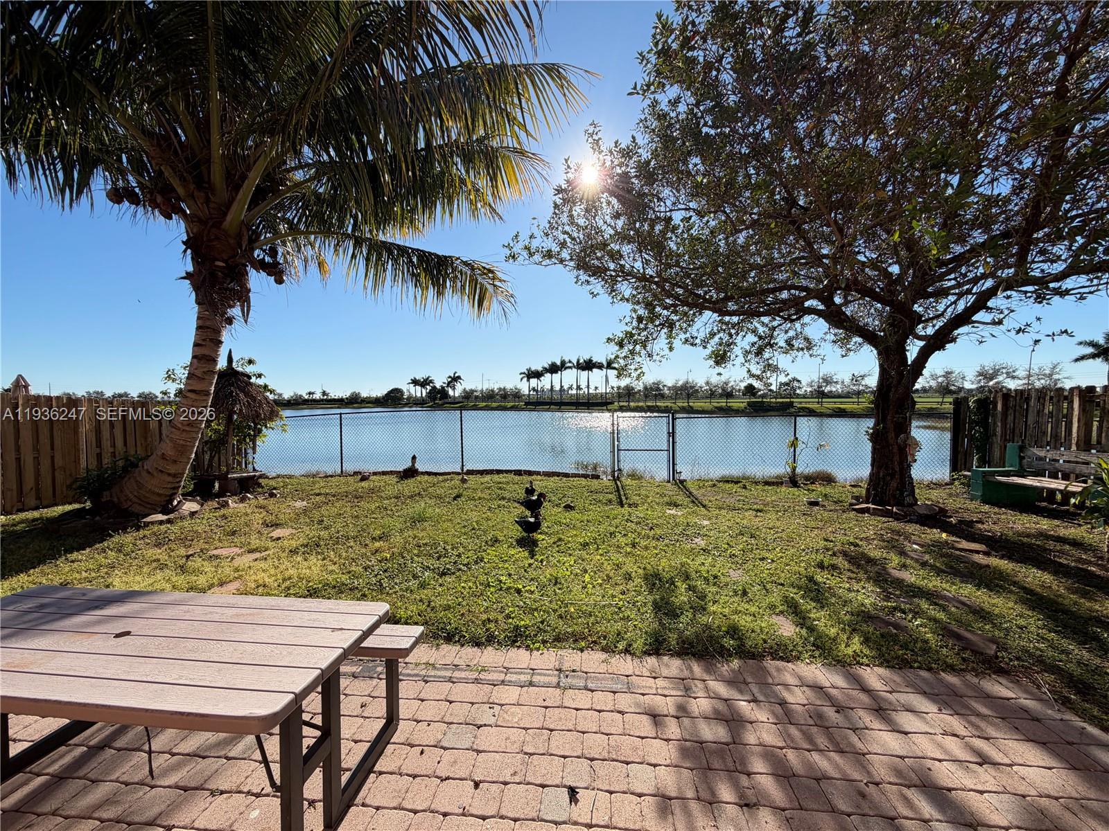 685 Southeast 37th Place Homestead, FL 33033 - Photo 3 of 11 a view of a yard with a patio