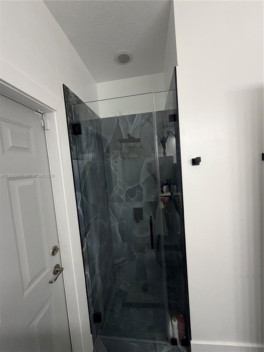 685 Southeast 37th Place Homestead, FL 33033 - Photo 10 of 11 a bathroom with a glass door shower