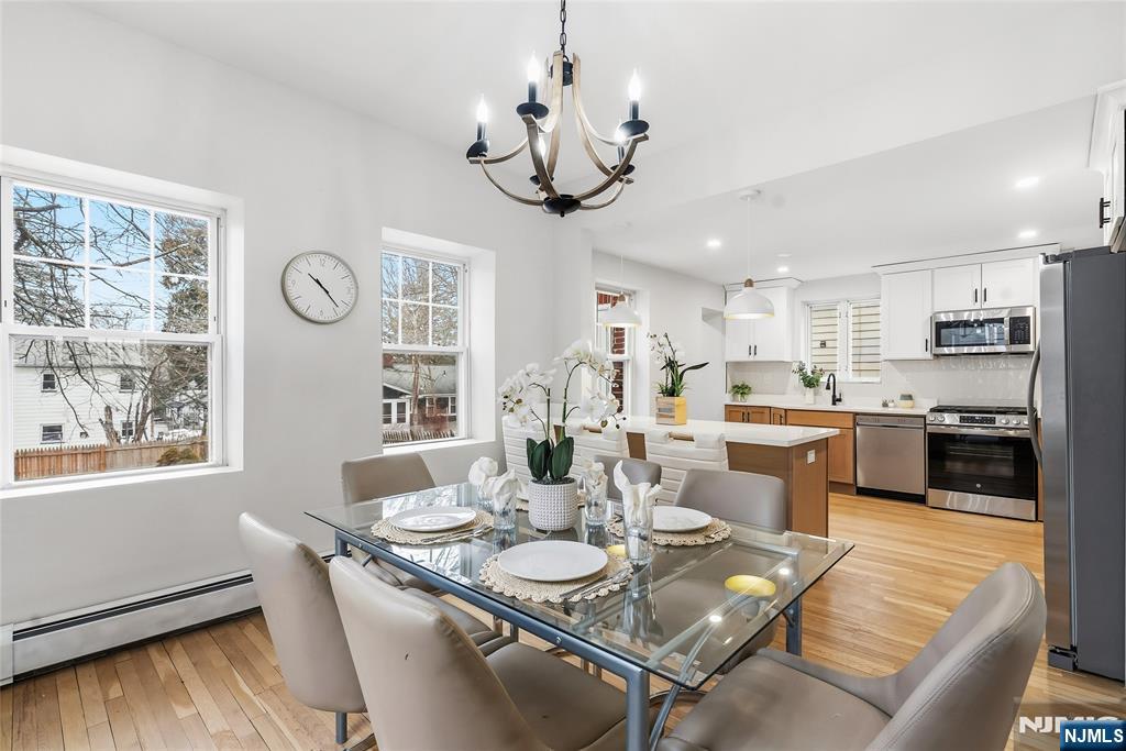 33 Robertson Road West Orange, NJ 07052 - Photo 11 of 48 a view of a dining room with furniture window and wooden floor