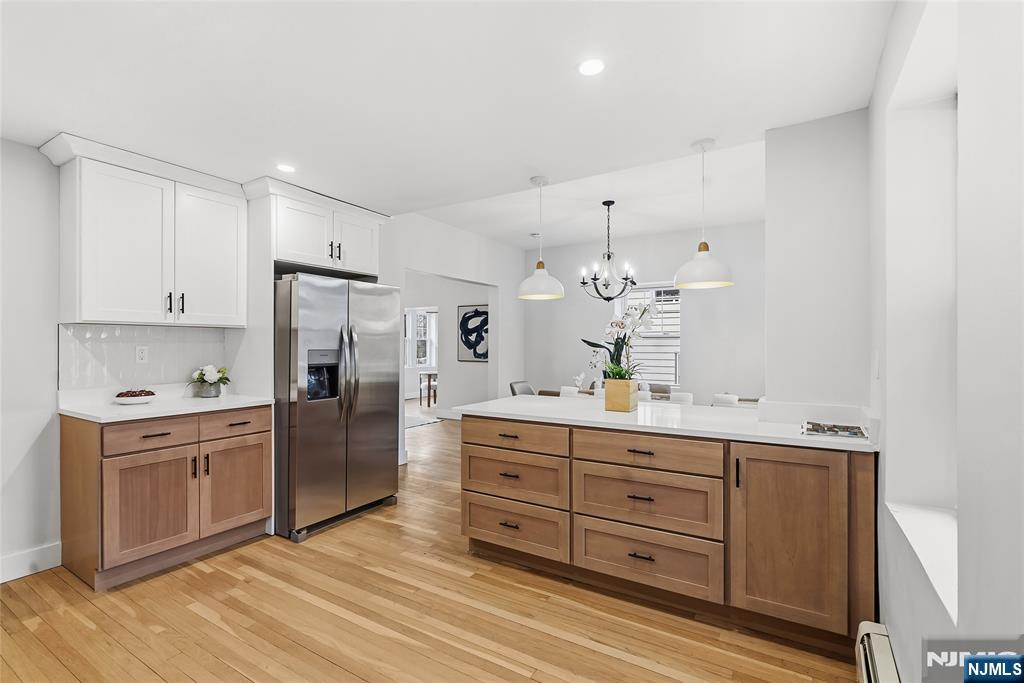 33 Robertson Road West Orange, NJ 07052 - Photo 13 of 48 a kitchen with a refrigerator and cabinets