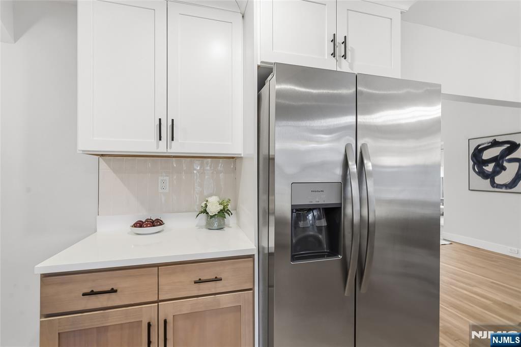 33 Robertson Road West Orange, NJ 07052 - Photo 14 of 48 a kitchen with a refrigerator and cabinets