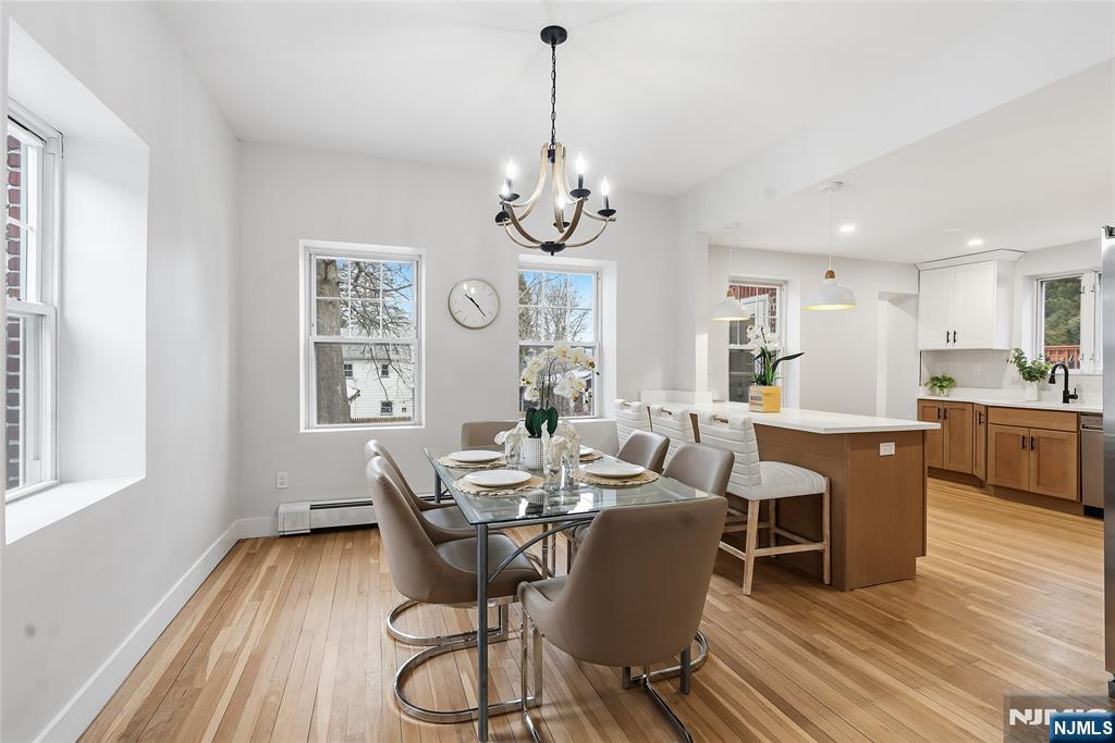 33 Robertson Road West Orange, NJ 07052 - Photo 15 of 48 a view of a dining room with furniture window and wooden floor