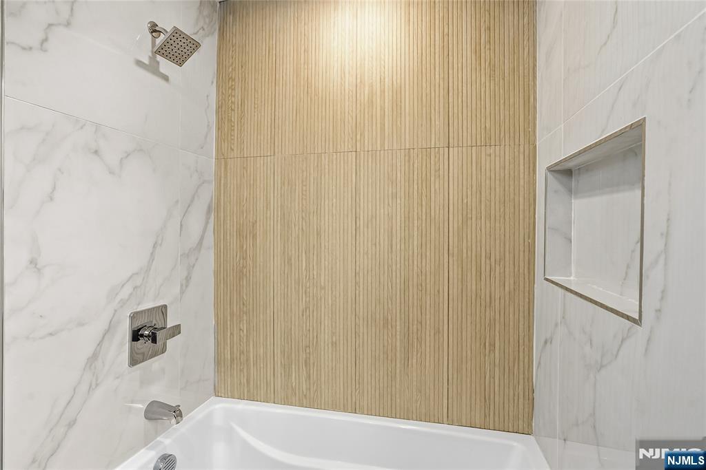 33 Robertson Road West Orange, NJ 07052 - Photo 26 of 48 a bathroom with a bathtub and shower