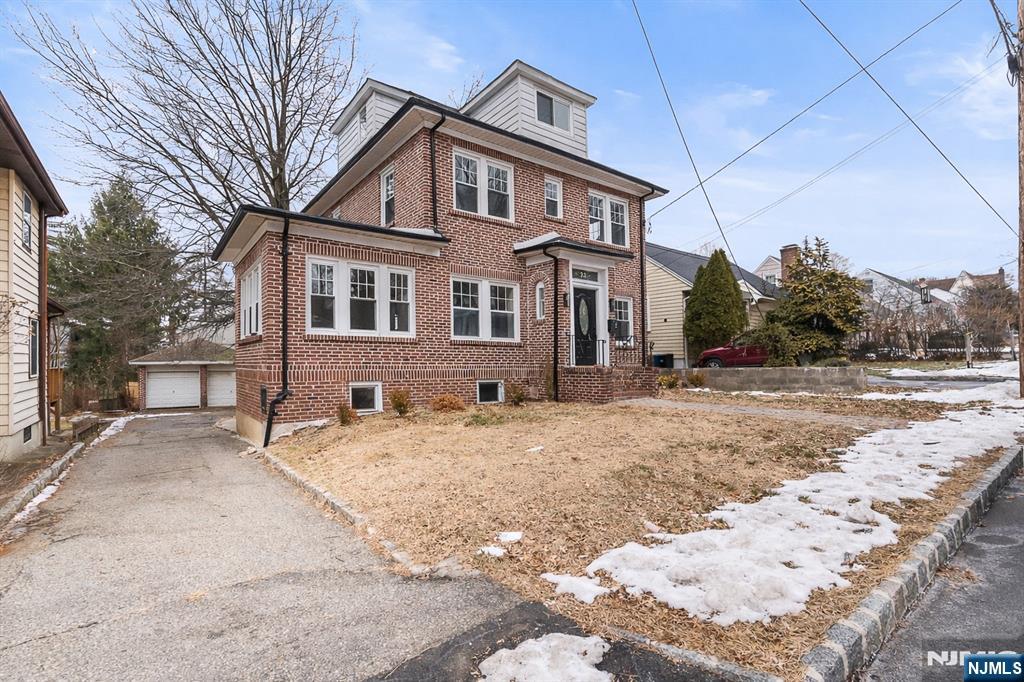 33 Robertson Road West Orange, NJ 07052 - Photo 3 of 48 a front view of a house with a yard