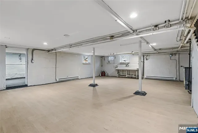 an empty room with closet and windows